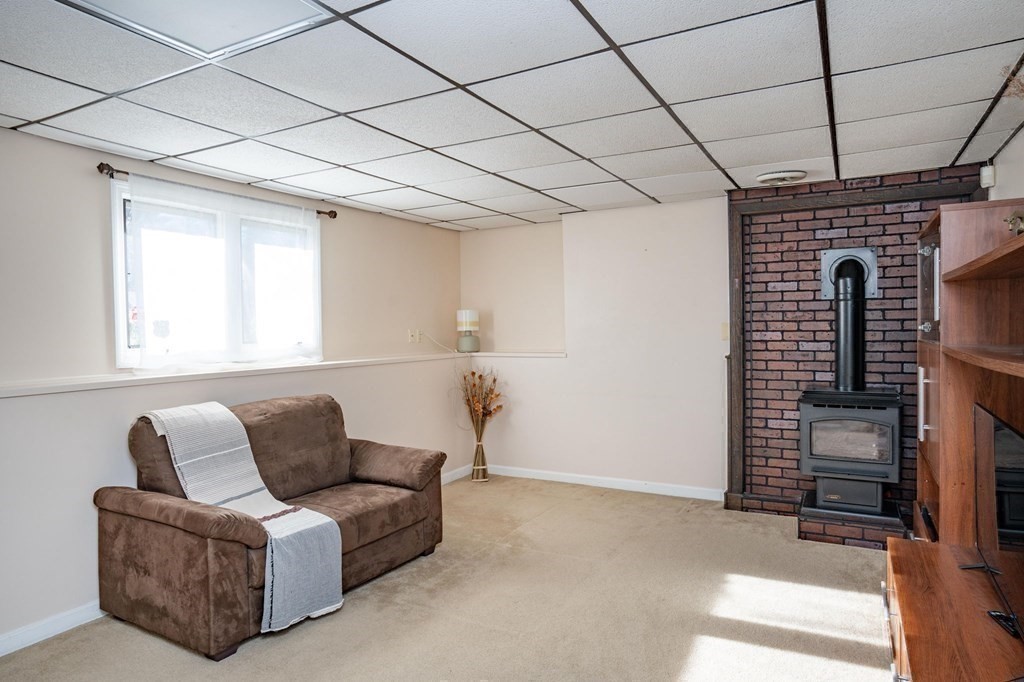 25 Sandy Ridge Road Stoughton, MA 02072 - Photo 28 of 42 a living room with furniture a couch and a ceiling fan