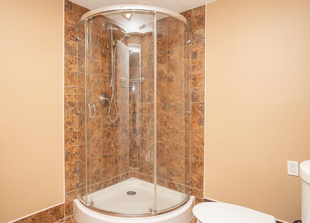 25 Sandy Ridge Road Stoughton, MA 02072 - Photo 31 of 42 a bathroom with a toilet and a shower