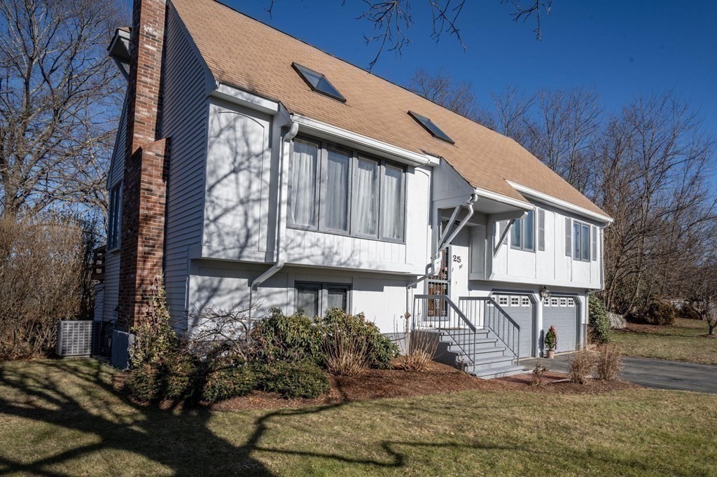 25 Sandy Ridge Road Stoughton, MA 02072 - Photo 34 of 42 a front view of a house with garden