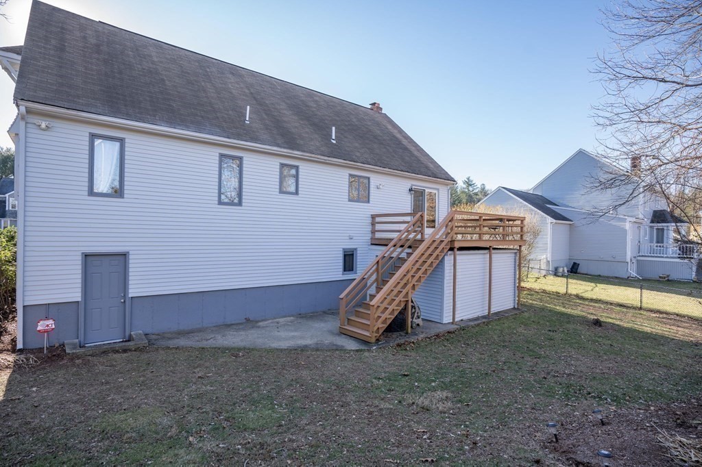 25 Sandy Ridge Road Stoughton, MA 02072 - Photo 36 of 42 a view of a house with backyard and utility area