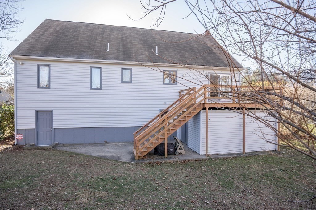 25 Sandy Ridge Road Stoughton, MA 02072 - Photo 37 of 42 a view of a house with a yard