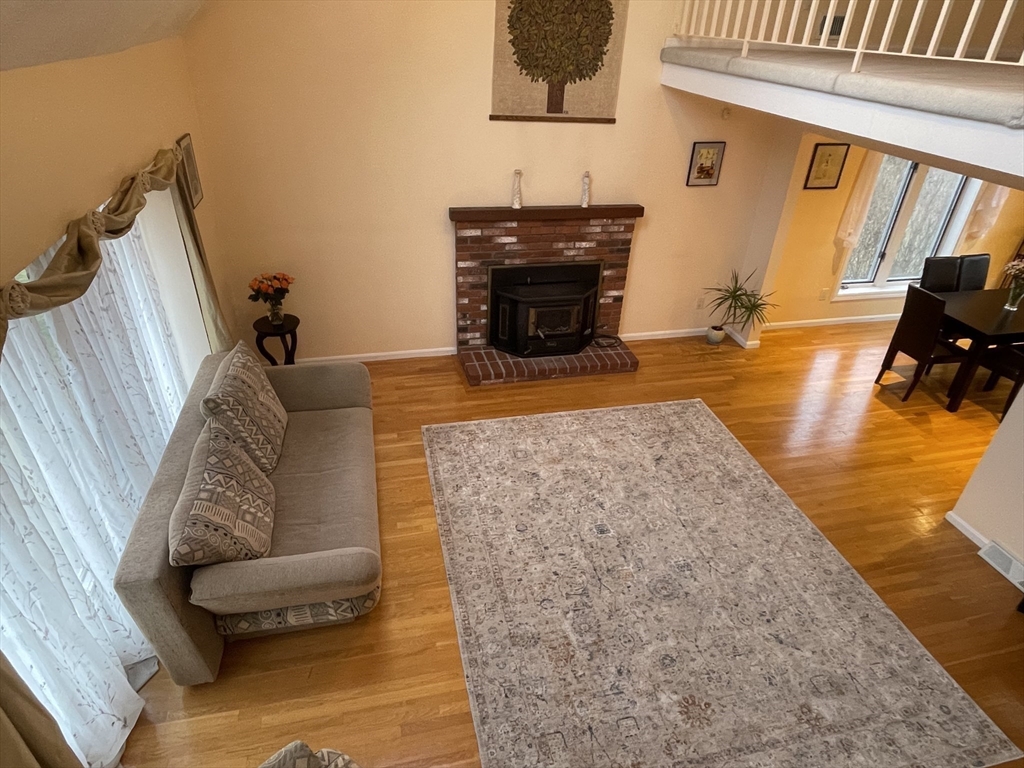 25 Sandy Ridge Road Stoughton, MA 02072 - Photo 4 of 42 a living room with furniture and a fireplace
