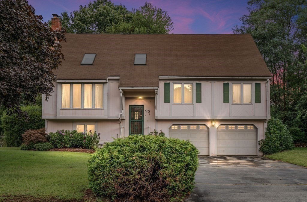 25 Sandy Ridge Road Stoughton, MA 02072 - Photo 42 of 42 a front view of a house with a yard and garden