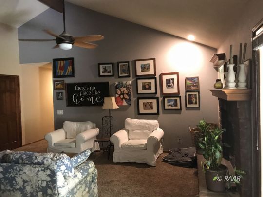 1009 Meadowview Lane Ridgecrest, CA 93555 - Photo 6 of 32 a living room with furniture potted plant and a ceiling fan