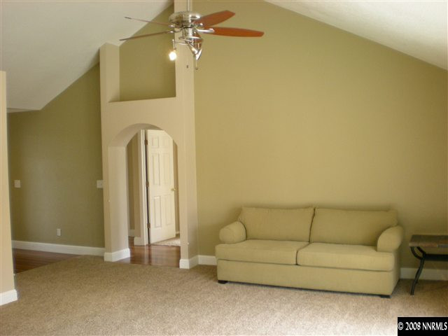 1440 Moon Lane Reno, NV 89521 - Photo 2 of 9 a living room with a couch and chandelier