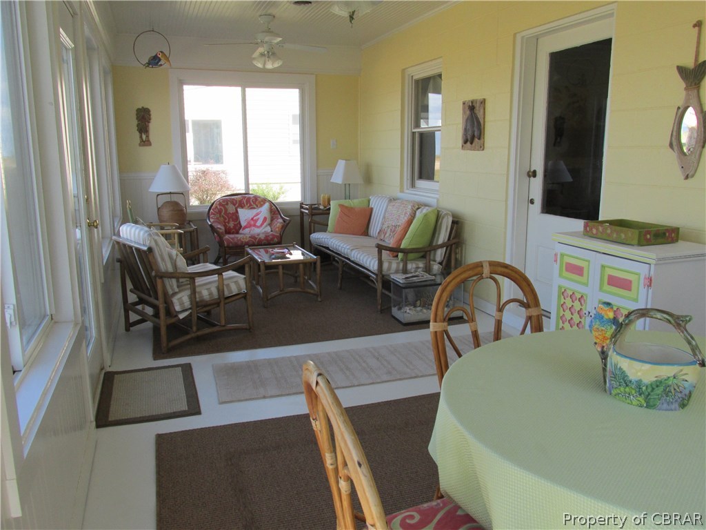 5 Sandy Beach Road Deltaville, VA 23043 - Photo 18 of 32 WOW! Yet another place to relax and enjoy visiting with friends or just quietly enjoying the magnificent view from this homes beautiful Florida room!
