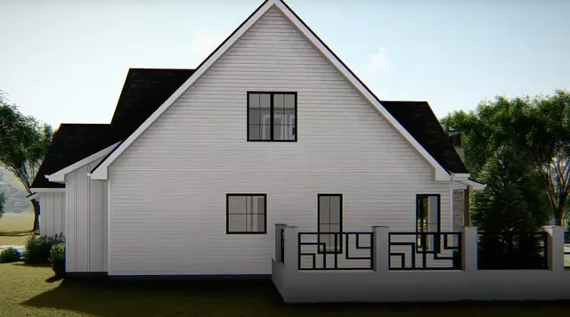 a view of a white house next to a yard