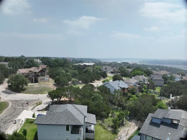 an aerial view of a house with a yard