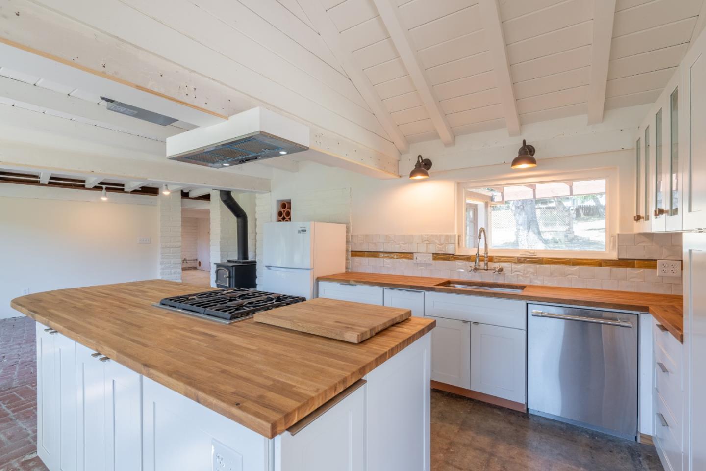 72 Los Laureles Grade Road Carmel Valley, CA 93924 - Photo 13 of 43 a kitchen with a sink stove and cabinets