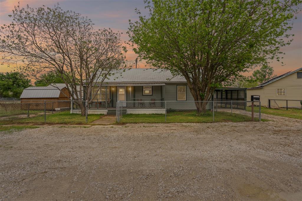 1205 Southwest 12th Street Mineral Wells, TX 76067 - Photo 1 of 23 a view of a house with a outdoor space