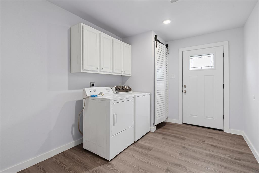 1205 Southwest 12th Street Mineral Wells, TX 76067 - Photo 16 of 23 a view of storage and utility room with wooden floor