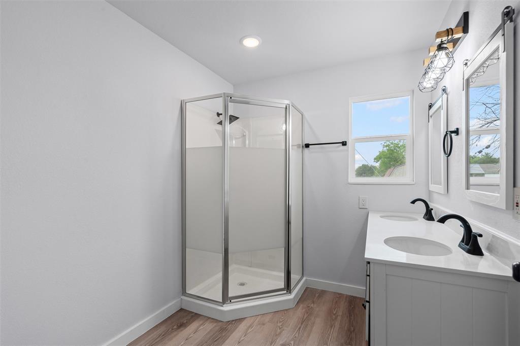 1205 Southwest 12th Street Mineral Wells, TX 76067 - Photo 17 of 23 a bathroom with a sink and a mirror