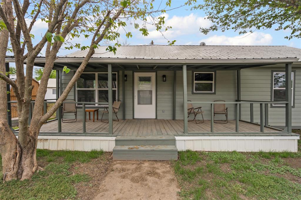 1205 Southwest 12th Street Mineral Wells, TX 76067 - Photo 2 of 23 a view of outdoor space yard and front view of a house