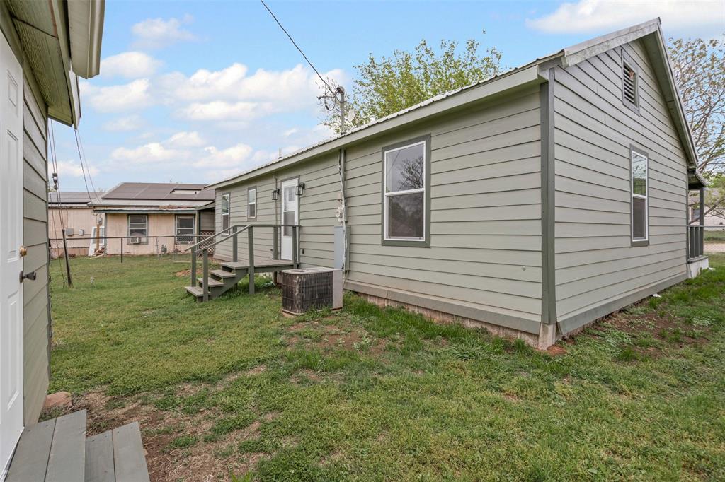 1205 Southwest 12th Street Mineral Wells, TX 76067 - Photo 22 of 23 a view of a house with backyard