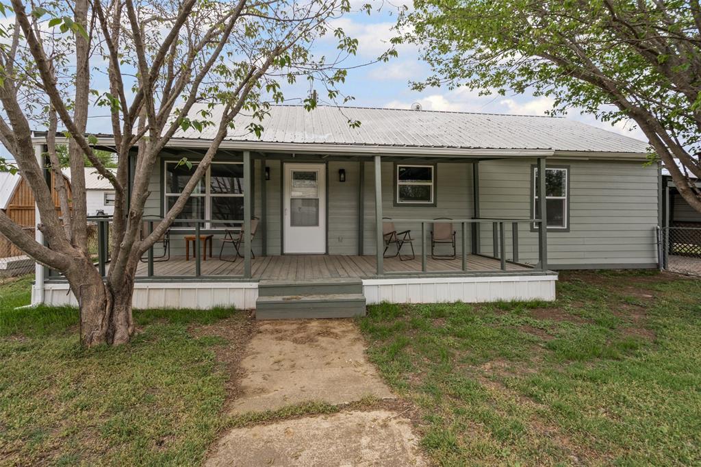 1205 Southwest 12th Street Mineral Wells, TX 76067 - Photo 3 of 23 a view of a house with a yard
