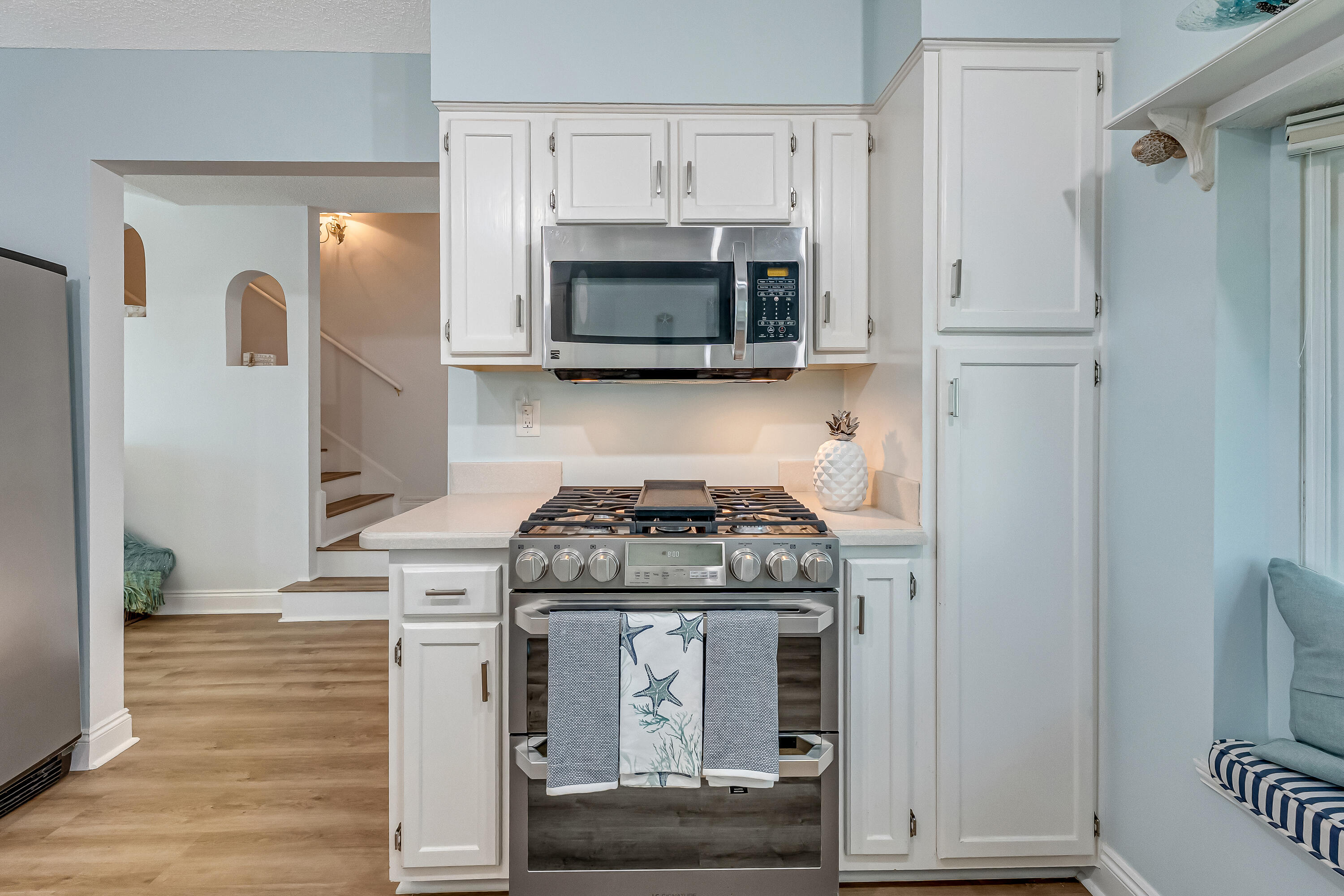 101 Port Drive Shalimar, FL 32579 - Photo 27 of 45 a kitchen with stainless steel appliances granite countertop white cabinets and a stove