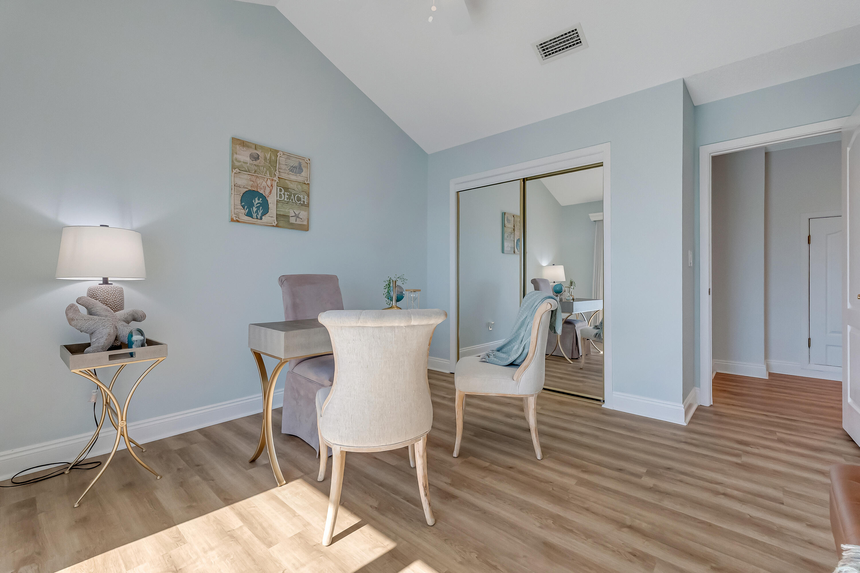 101 Port Drive Shalimar, FL 32579 - Photo 37 of 45 a view of a dining room with furniture and wooden floor