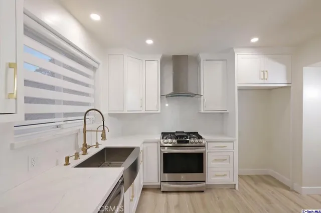 a view of a hallway with closet and cabinet