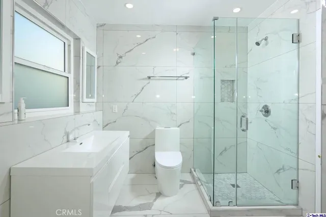 a bathroom with a bathtub and shower