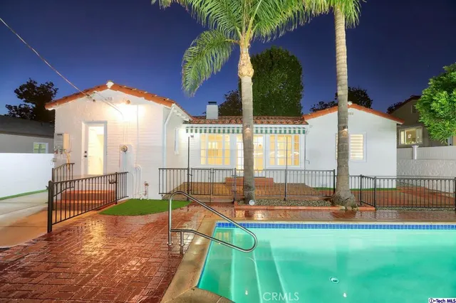 a swimming pool with an outdoor seating