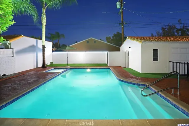 a view of a house with swimming pool