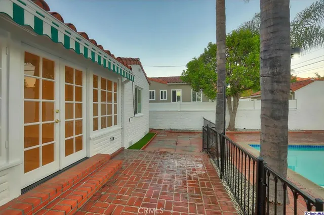 a view of a porch with wooden floor and stairs