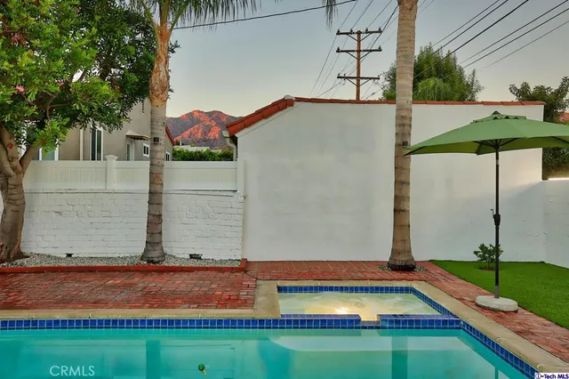 a view of a house with swimming pool
