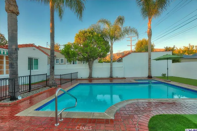 a front view of house with yard and outdoor seating