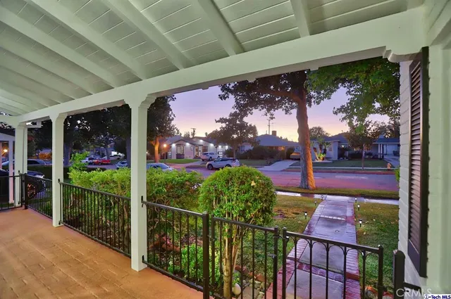 a view of a porch and a yard