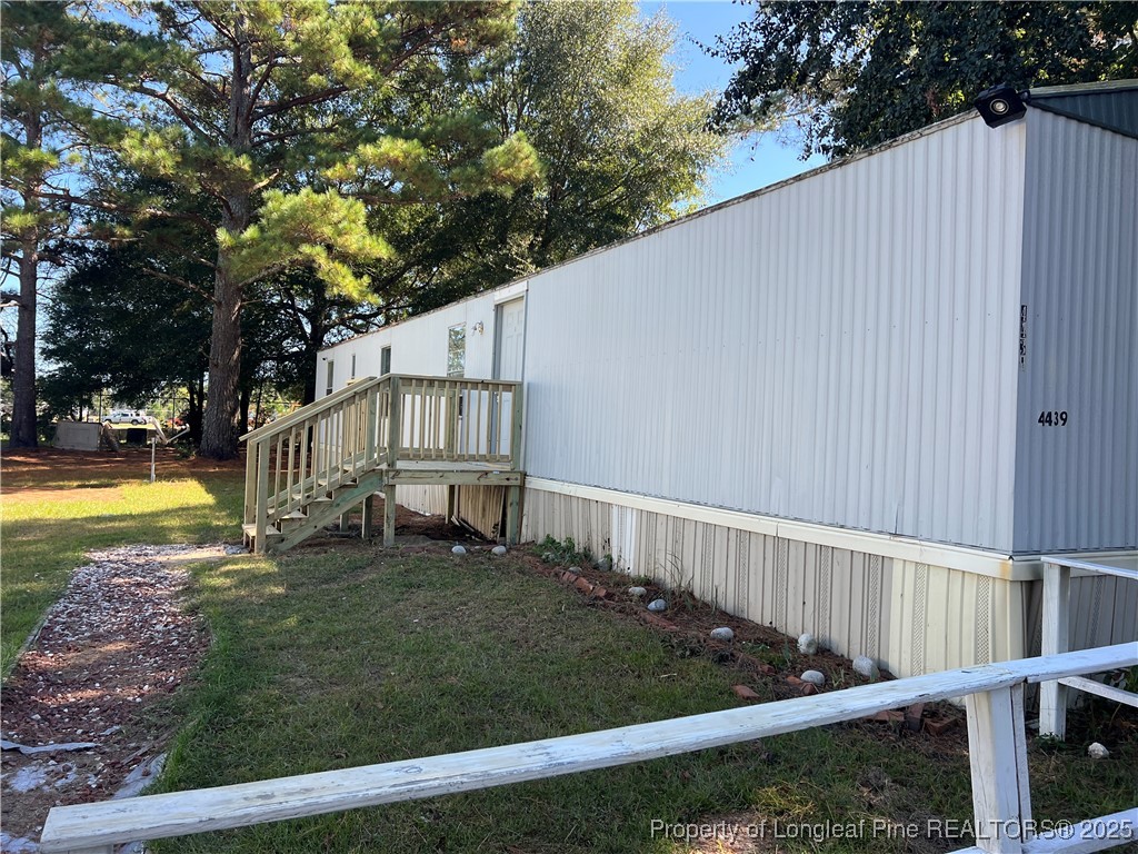 4439 Betsy Ross Drive Hope Mills, NC 28348 - Photo 2 of 9 a view of a house with backyard and sitting area