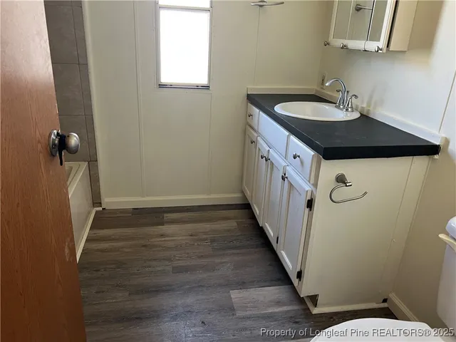 a bathroom with sink and mirror
