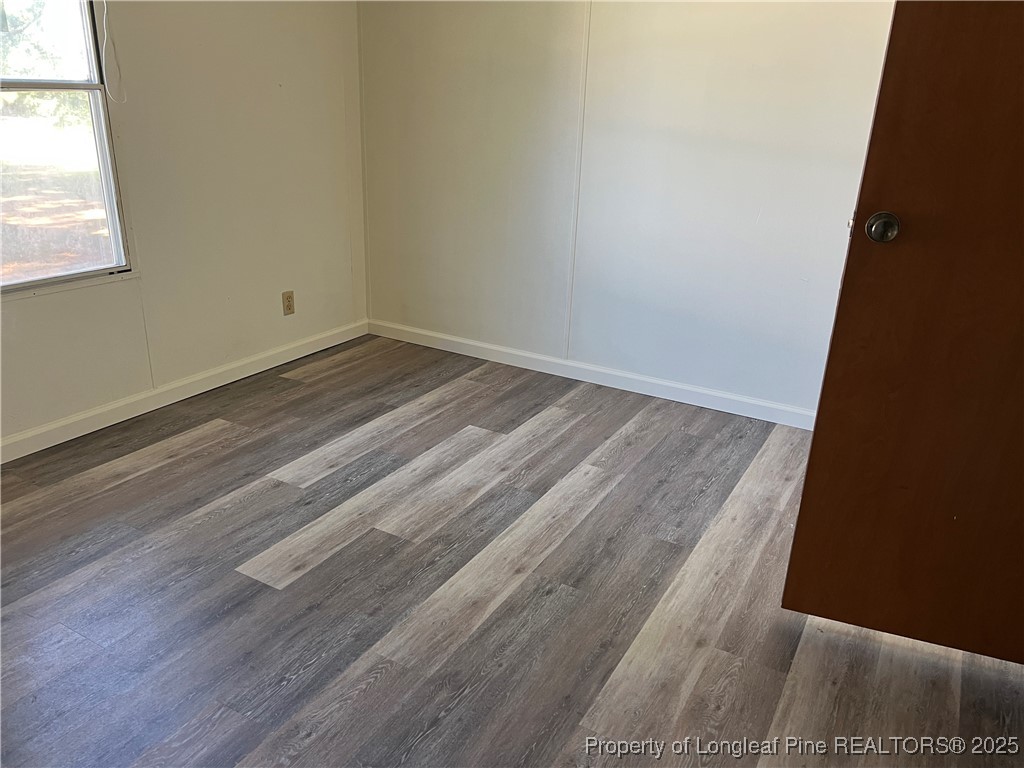 4439 Betsy Ross Drive Hope Mills, NC 28348 - Photo 5 of 9 a view of a room with wooden floor and small window