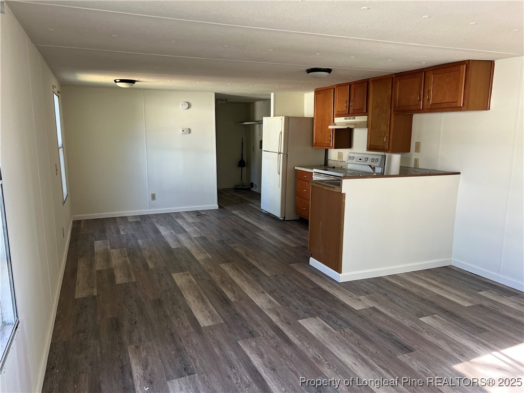 4439 Betsy Ross Drive Hope Mills, NC 28348 - Photo 8 of 9 a view of kitchen with wooden floor and electronic appliances