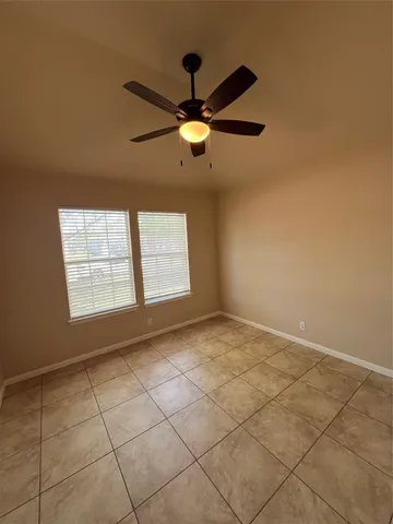 an empty room with a empty space and windows