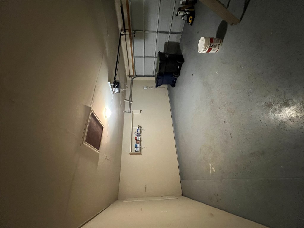 129 Holmstrom Street Hutto, TX 78634 - Photo 25 of 26 Garage featuring a garage door opener