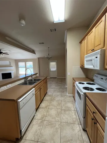 a kitchen with a stove and a sink