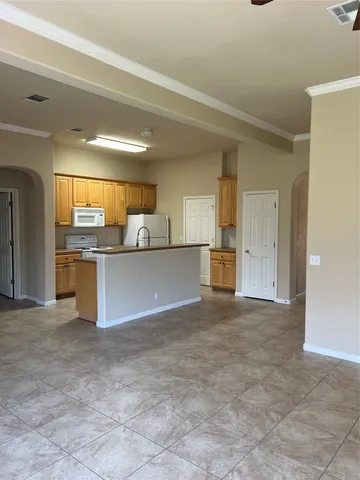 a kitchen with a stove and a sink