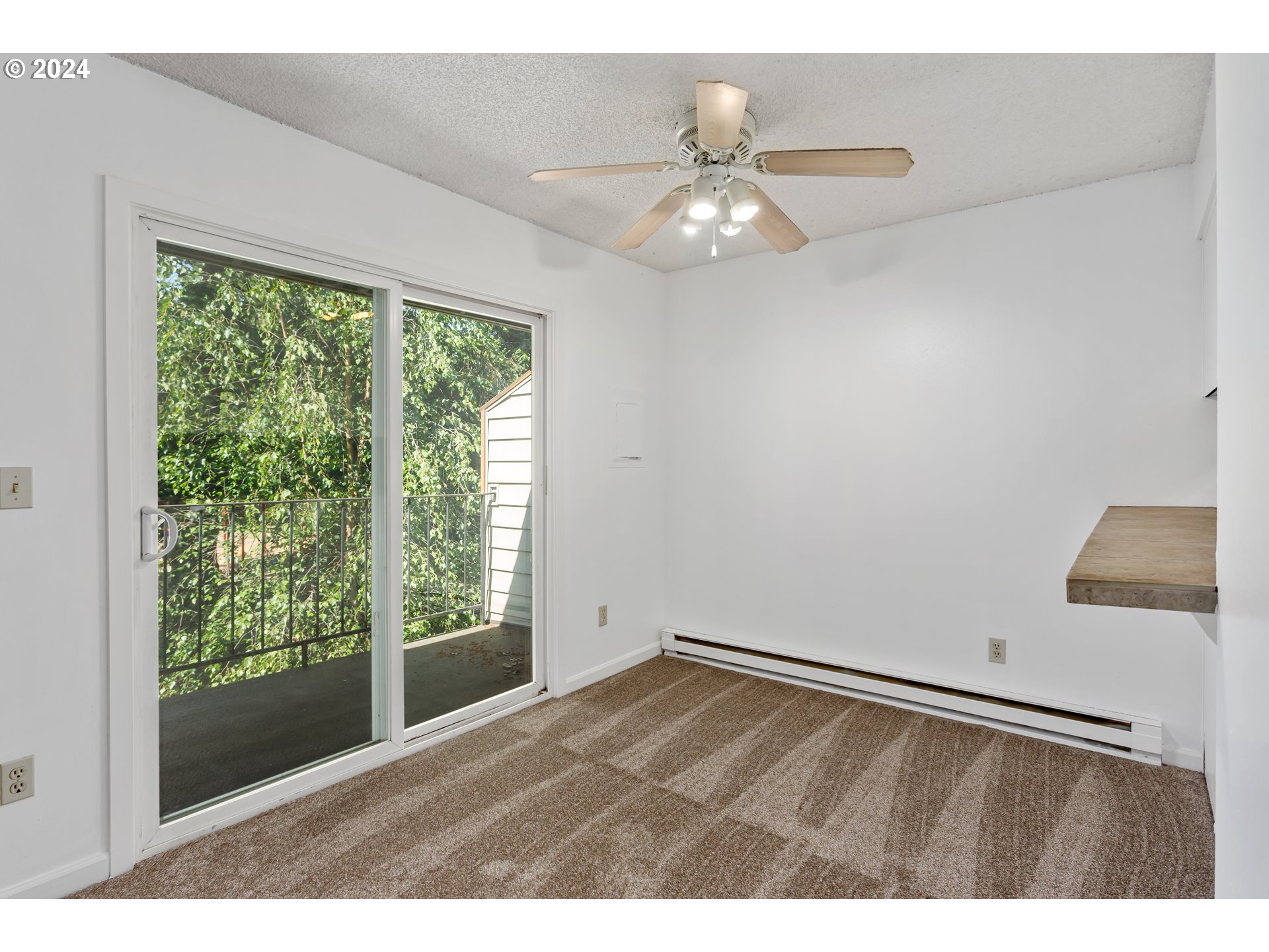 11377 Southwest Springwood Drive, Unit 34 Portland, OR 97223 - Photo 11 of 28 a view of an empty room with a window