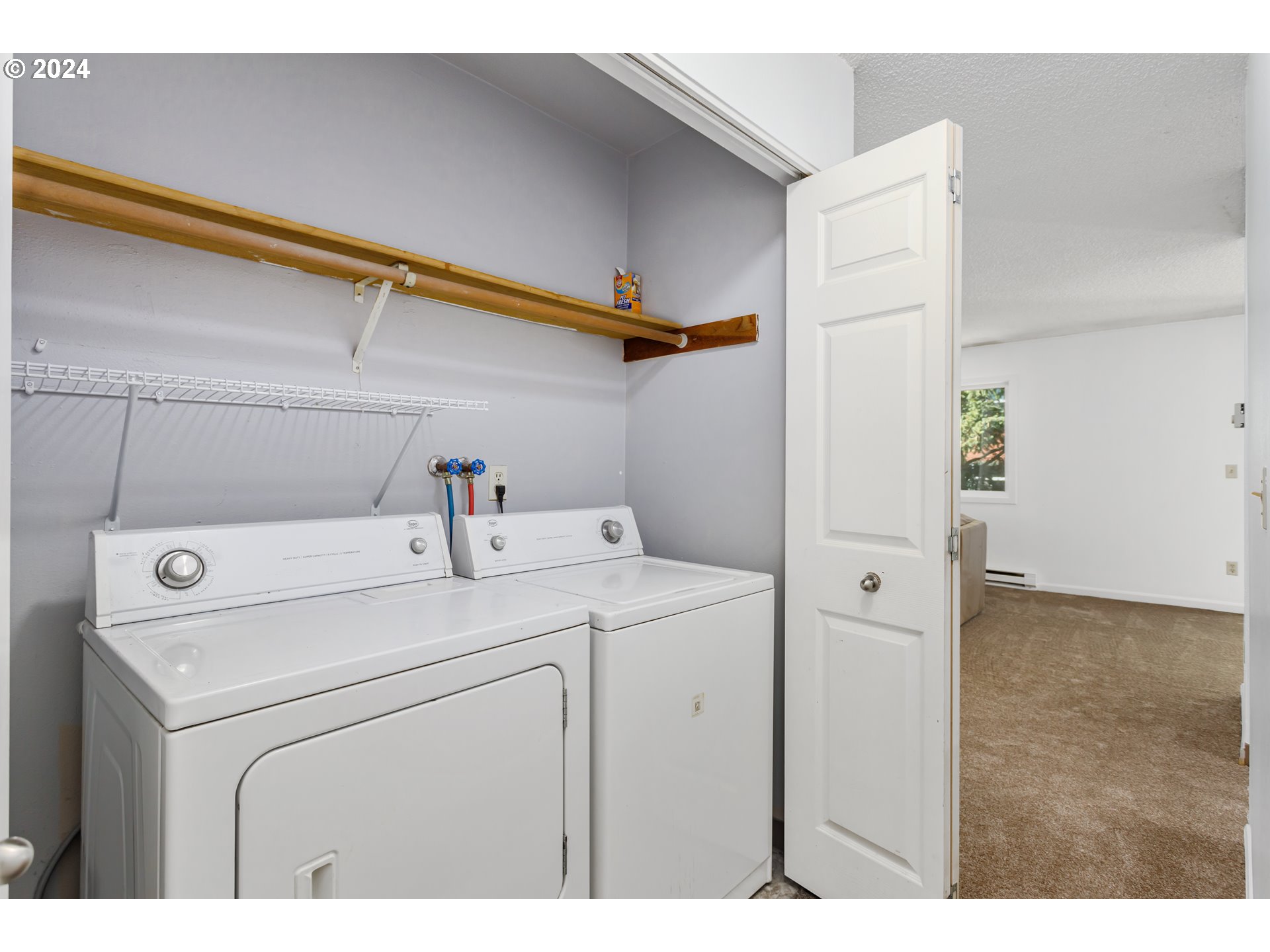11377 Southwest Springwood Drive, Unit 34 Portland, OR 97223 - Photo 23 of 28 a utility room with dryer and washer