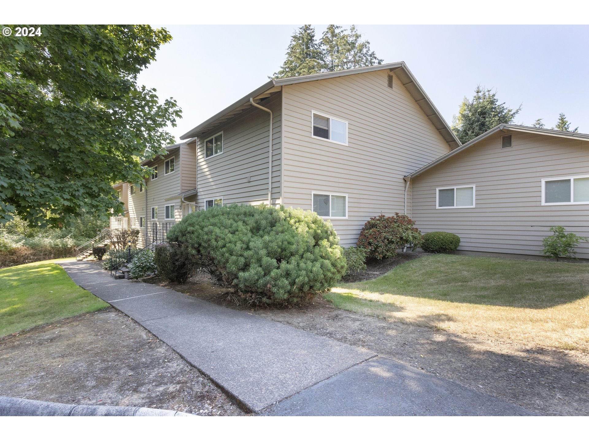 11377 Southwest Springwood Drive, Unit 34 Portland, OR 97223 - Photo 3 of 28 a view of backyard of house