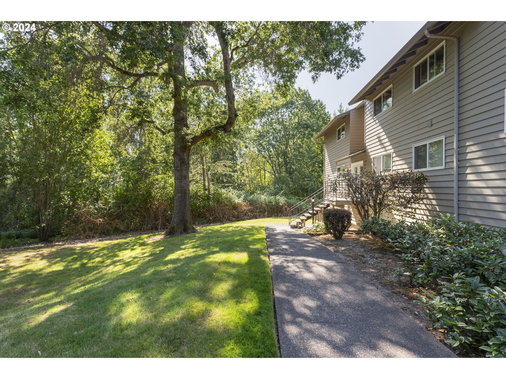 11377 Southwest Springwood Drive, Unit 34 Portland, OR 97223 - Photo 4 of 28 a view of outdoor space and yard