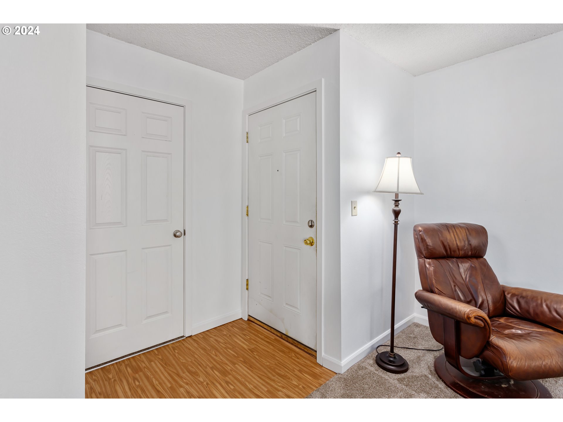 11377 Southwest Springwood Drive, Unit 34 Portland, OR 97223 - Photo 5 of 28 a living room with furniture and a lamp