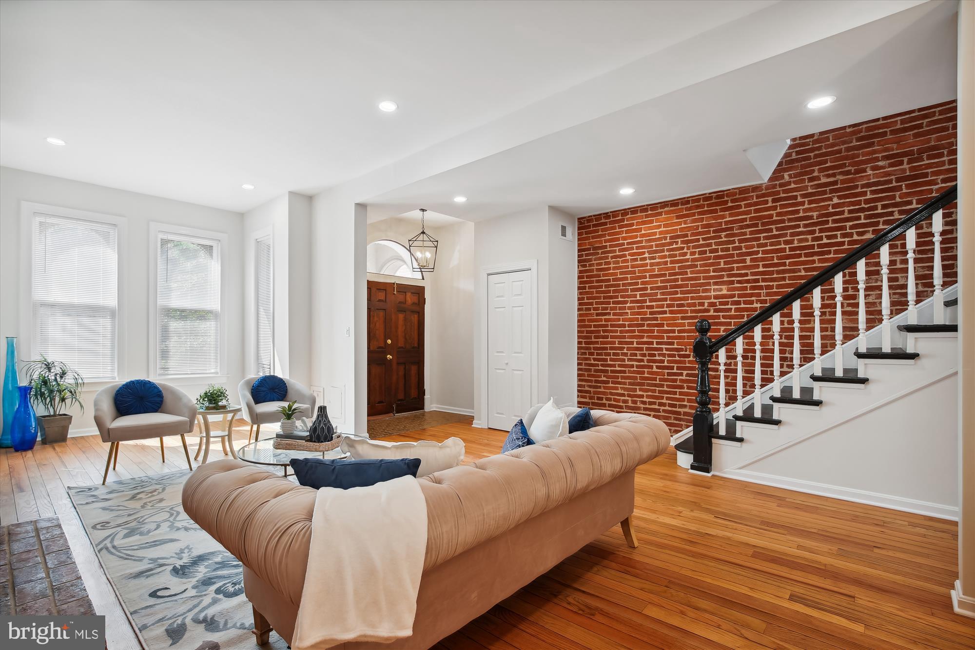 616 E Street Northeast Washington, DC 20002 - Photo 21 of 79 a living room with furniture or stairs and a wooden floor