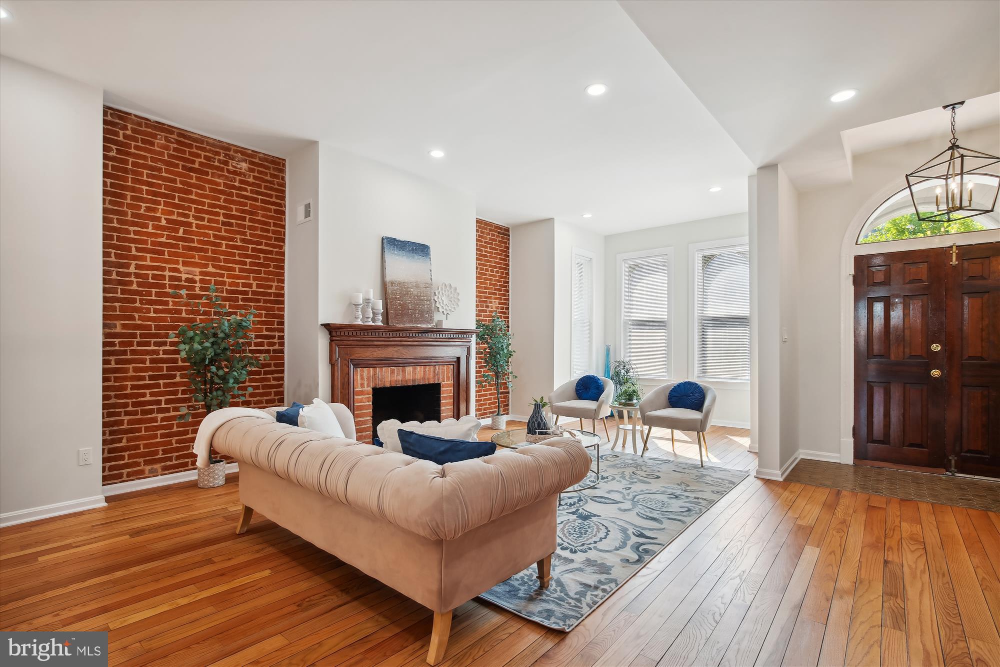 616 E Street Northeast Washington, DC 20002 - Photo 22 of 79 a living room with furniture and a fireplace