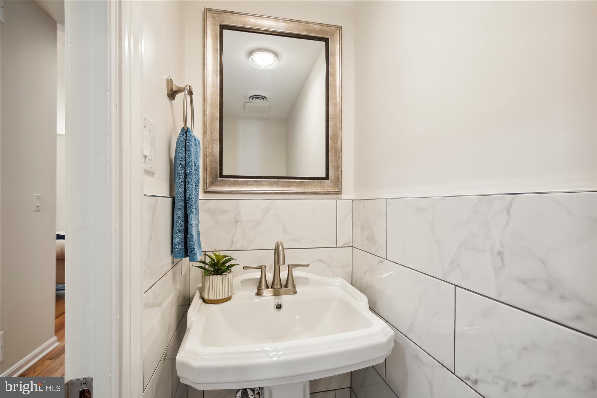 616 E Street Northeast Washington, DC 20002 - Photo 30 of 79 a bathroom with a sink and a mirror