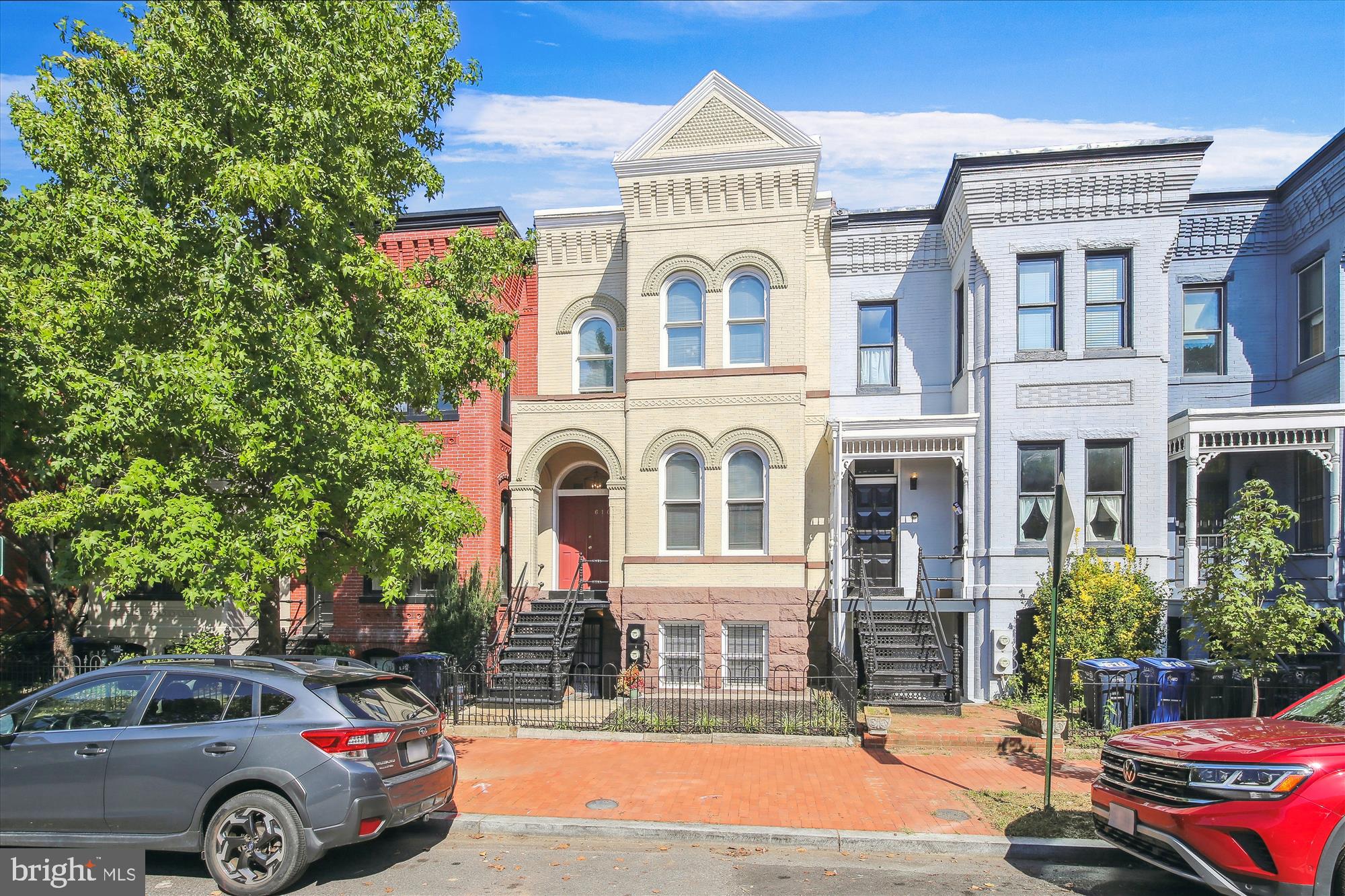 616 E Street Northeast Washington, DC 20002 - Photo 3 of 79 a front view of a residential apartment building with a yard