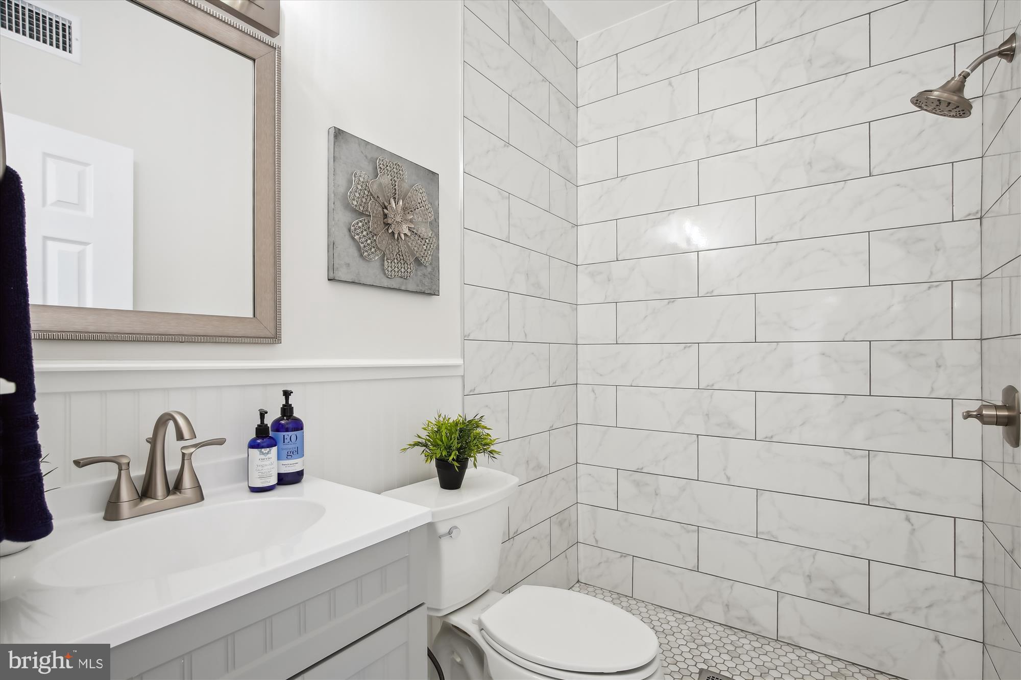 616 E Street Northeast Washington, DC 20002 - Photo 33 of 79 a bathroom with a sink toilet and shower