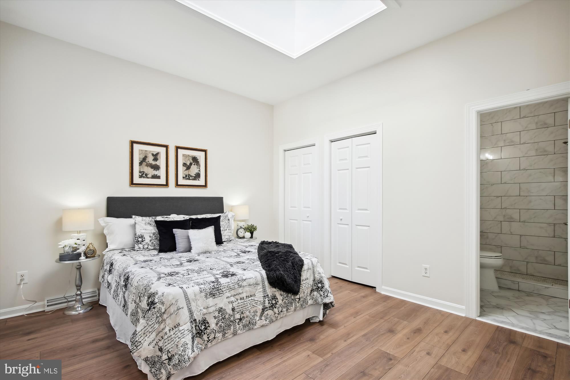 616 E Street Northeast Washington, DC 20002 - Photo 36 of 79 a bedroom with a bed and wooden floor