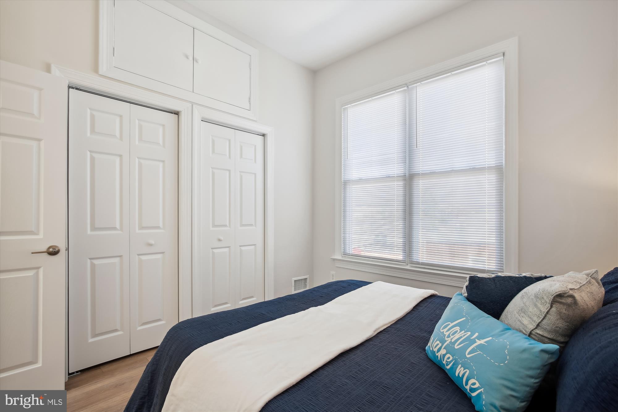 616 E Street Northeast Washington, DC 20002 - Photo 40 of 79 a bedroom with furniture and a window
