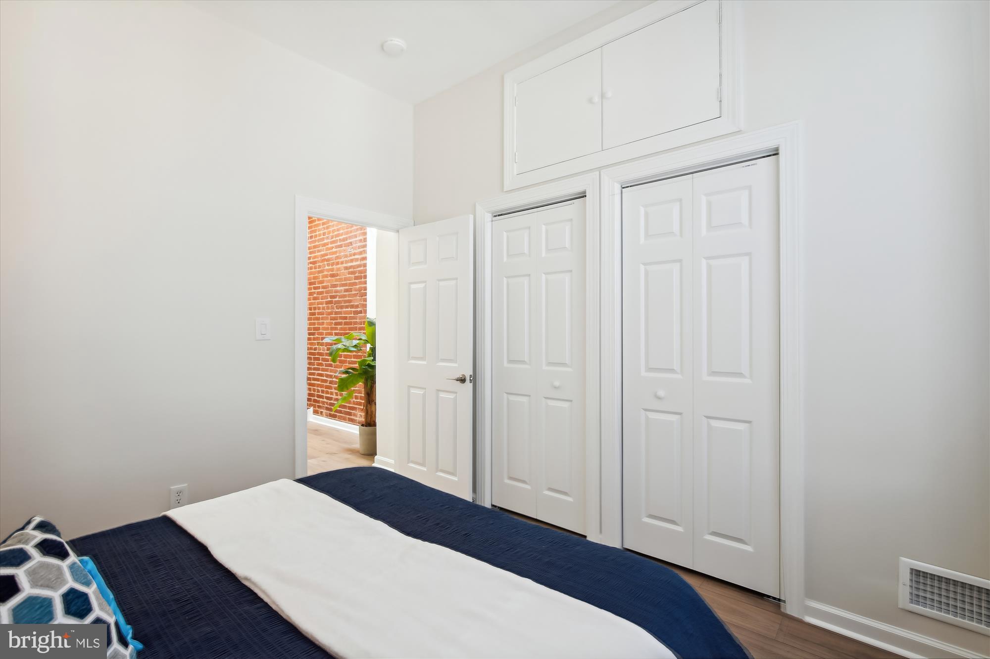 616 E Street Northeast Washington, DC 20002 - Photo 42 of 79 a bedroom with a bed and a dresser